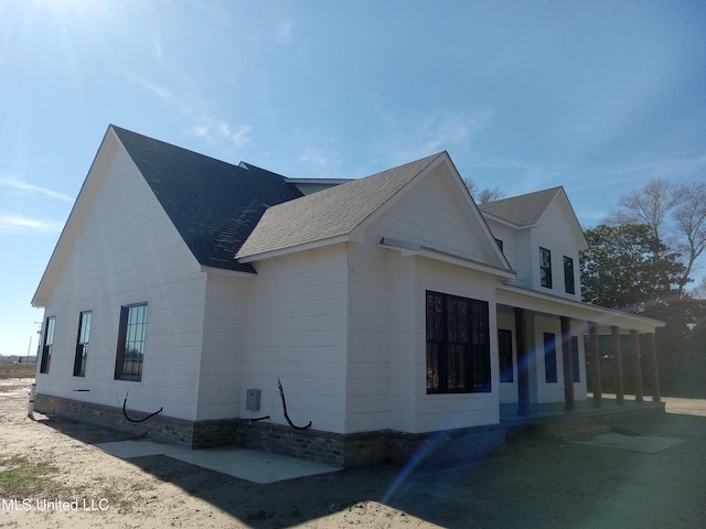 1400 Bayou Dr, Indianola, MS 38751 - view of property exterior with covered porch and a shingled roof