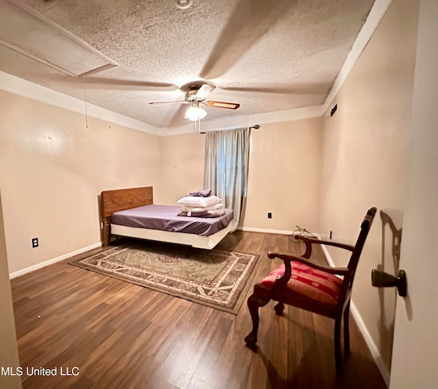 bedroom with dark wood-type flooring, a textured ceiling, and ceiling fan