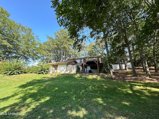 view of yard featuring a wooden deck