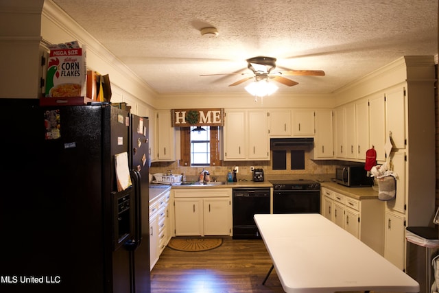 kitchen with exhaust hood, white cabinetry, dark hardwood / wood-style floors, black appliances, and crown molding