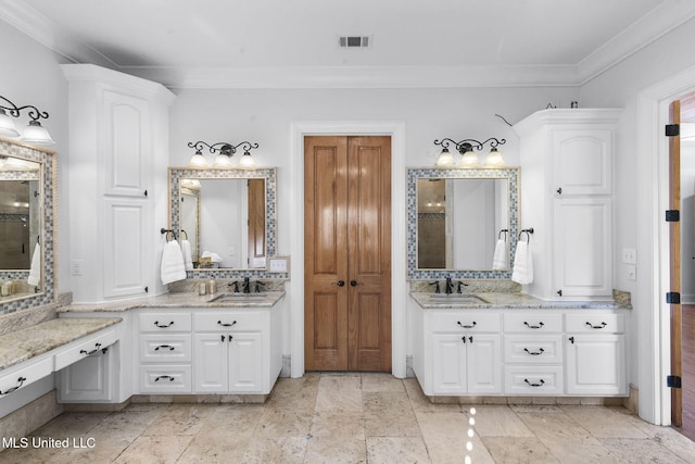 bathroom with vanity and ornamental molding