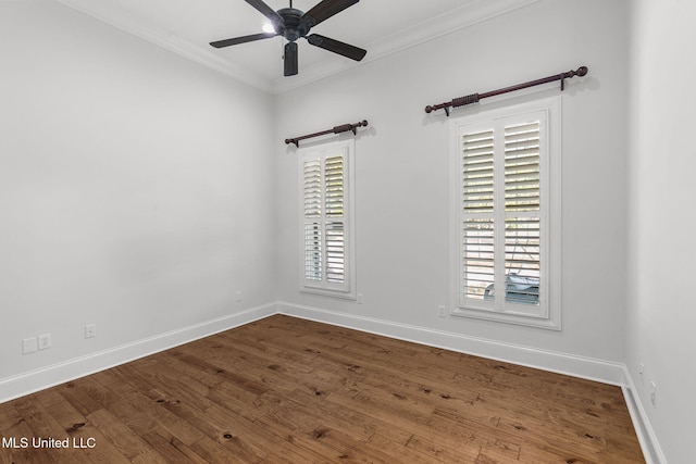 empty room featuring ornamental molding, hardwood / wood-style floors, and ceiling fan