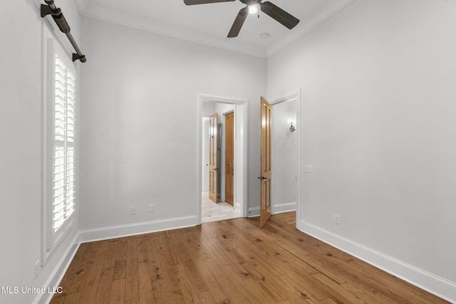 unfurnished room featuring crown molding, light hardwood / wood-style flooring, and ceiling fan