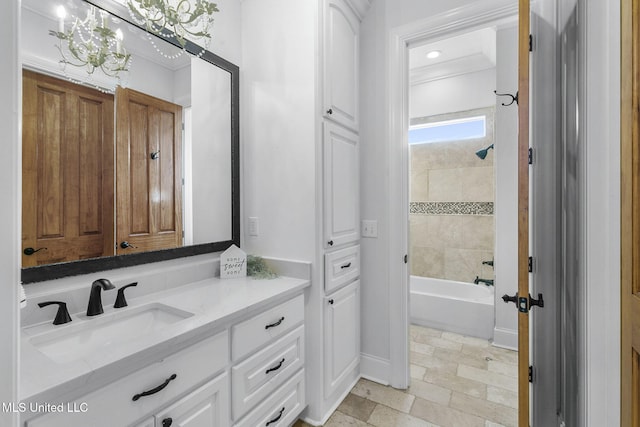 bathroom with vanity and tiled shower / bath