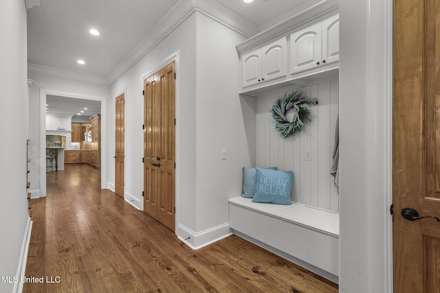 mudroom featuring hardwood / wood-style flooring and ornamental molding