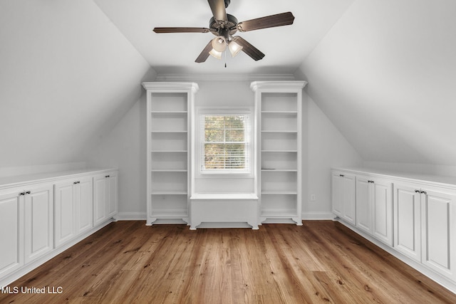 additional living space featuring light hardwood / wood-style flooring, ceiling fan, and vaulted ceiling