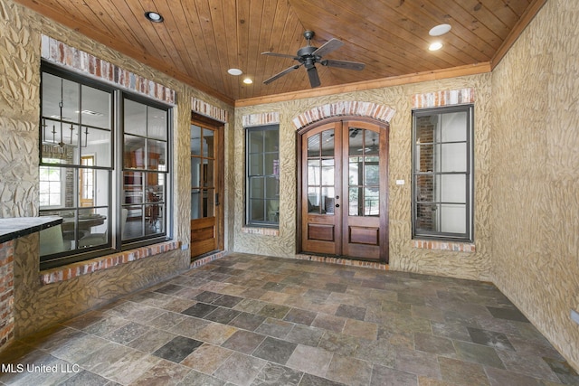 doorway to property featuring french doors, ceiling fan, and a patio area