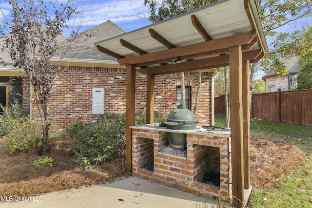 view of patio with a grill and an outdoor kitchen