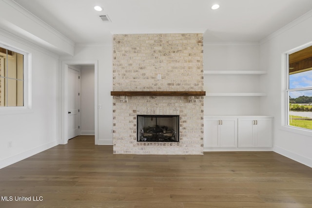 101 Harbour Lndg, Madison, MS 39110 - unfurnished living room featuring crown molding, wood finished floors, a fireplace, recessed lighting, and baseboards