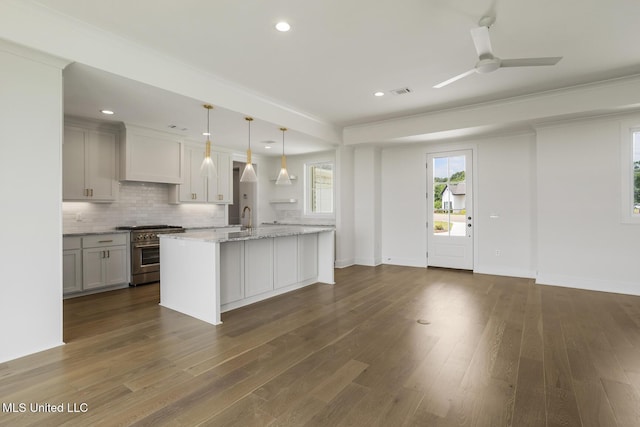 101 Harbour Lndg, Madison, MS 39110 - kitchen featuring high end stainless steel range, a sink, decorative backsplash, dark wood finished floors, and recessed lighting