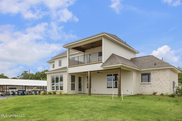 101 Harbour Lndg, Madison, MS 39110 - rear view of house featuring a balcony, a ceiling fan, a lawn, a shingled roof, and brick siding
