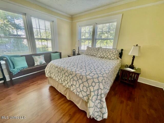 bedroom featuring crown molding, multiple windows, and dark hardwood / wood-style floors