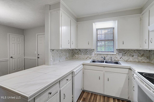 kitchen with sink, white appliances, white cabinets, decorative backsplash, and tile countertops