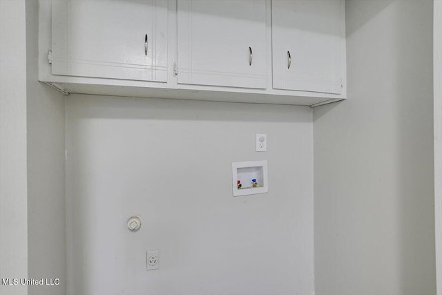 clothes washing area with cabinets, washer hookup, and hookup for an electric dryer