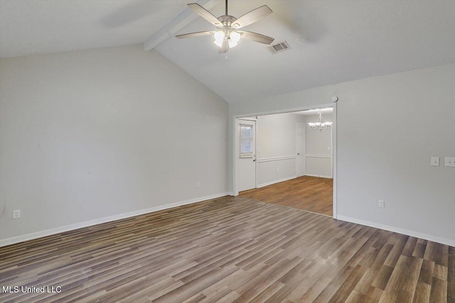 empty room featuring vaulted ceiling with beams, ceiling fan with notable chandelier, and hardwood / wood-style floors