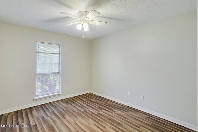 spare room with hardwood / wood-style flooring, a textured ceiling, and ceiling fan