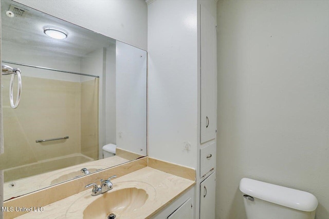 full bathroom featuring vanity, bathtub / shower combination, and toilet