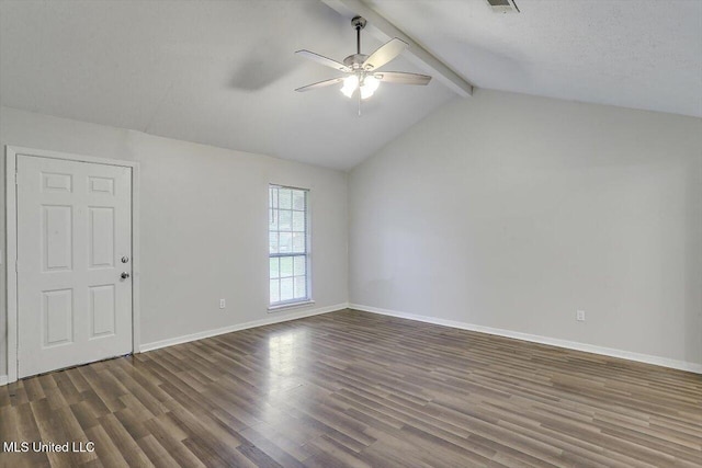 unfurnished room featuring ceiling fan, dark hardwood / wood-style floors, a textured ceiling, and vaulted ceiling with beams