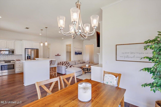 200 Falls Xing, Madison, MS 39110 - dining room with wood finished floors, a chandelier, crown molding, and recessed lighting