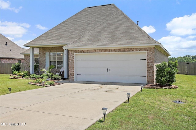 200 Falls Xing, Madison, MS 39110 - view of front facade featuring driveway, a garage, brick siding, and roof with shingles
