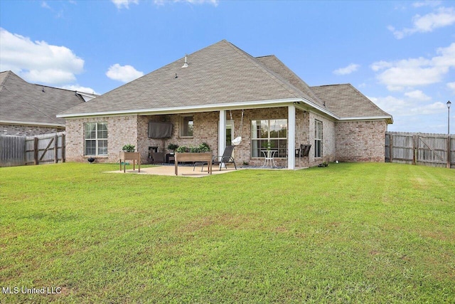 200 Falls Xing, Madison, MS 39110 - rear view of house with a patio, a fenced backyard, brick siding, and a shingled roof