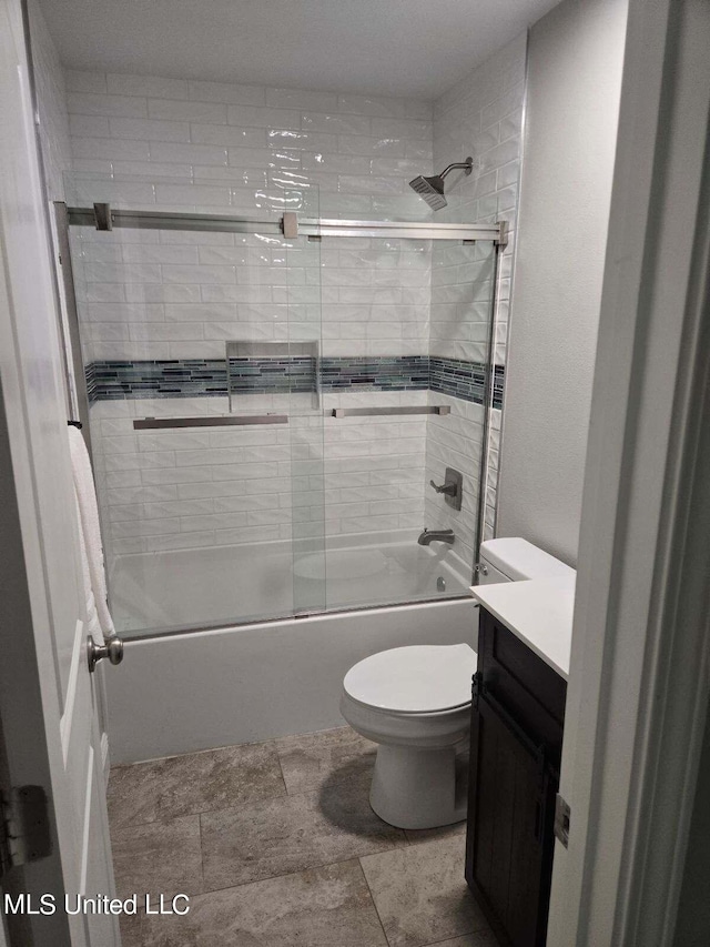 full bathroom with vanity, toilet, and enclosed tub / shower combo