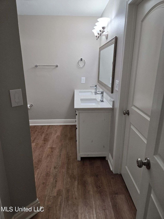 bathroom with vanity and hardwood / wood-style floors