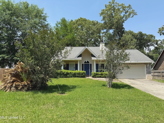 8918 Kipapa Way, Diamondhead, MS 39525 - view of front of house featuring a front yard, a garage, driveway, a chimney, and fence