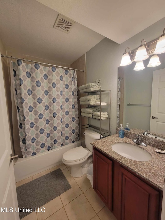bathroom with toilet, shower / bath combo with shower curtain, vanity, visible vents, and tile patterned flooring