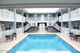 community pool featuring a patio area and stairway