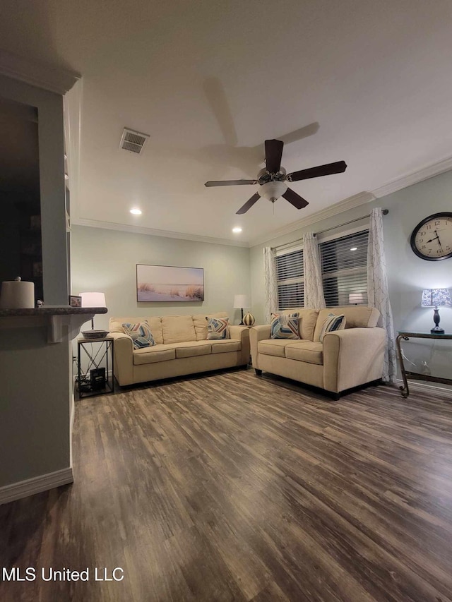 living room with baseboards, ornamental molding, ceiling fan, visible vents, and dark wood-type flooring