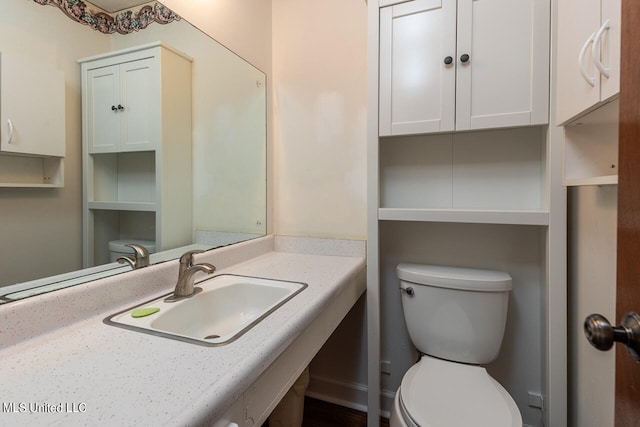 bathroom featuring toilet and sink