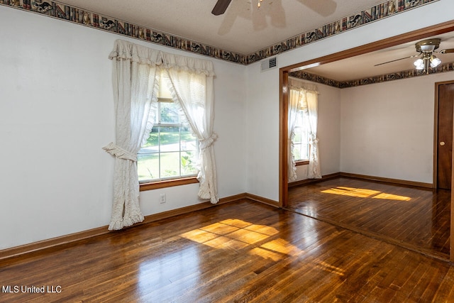 unfurnished room with a textured ceiling, hardwood / wood-style flooring, and ceiling fan