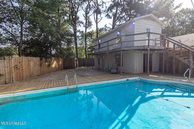 view of pool with a wooden deck