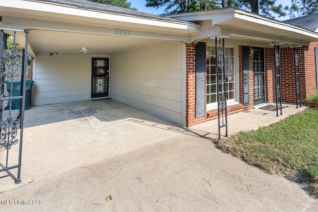 doorway to property with a carport