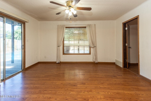 unfurnished room with crown molding, hardwood / wood-style floors, a textured ceiling, and ceiling fan