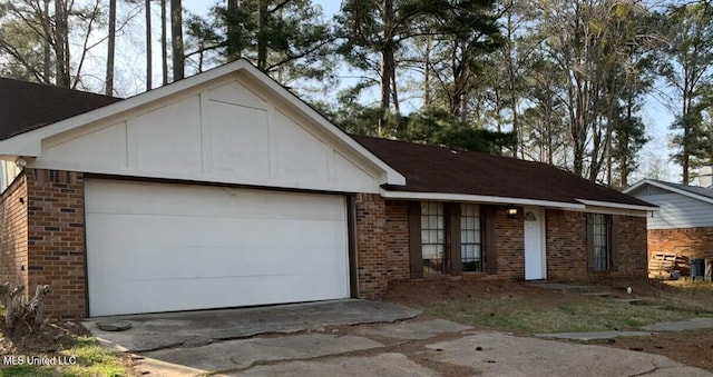 ranch-style house with brick siding, driveway, and an attached garage