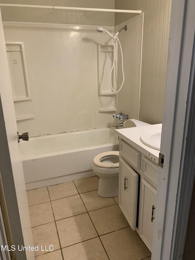 bathroom with tile patterned flooring, tub / shower combination, toilet, and vanity