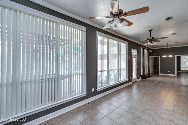 tiled empty room with ornamental molding, a notable chandelier, and a textured ceiling