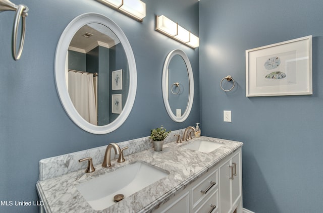 bathroom featuring vanity and ornamental molding