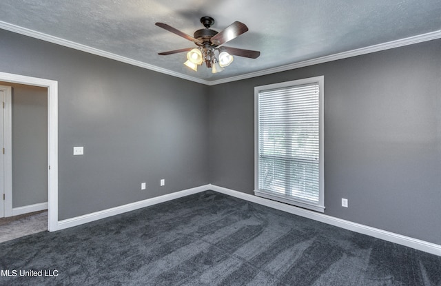 empty room with dark carpet, crown molding, a textured ceiling, and ceiling fan