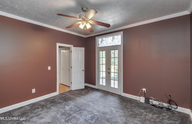 spare room featuring french doors, ornamental molding, light colored carpet, a textured ceiling, and ceiling fan