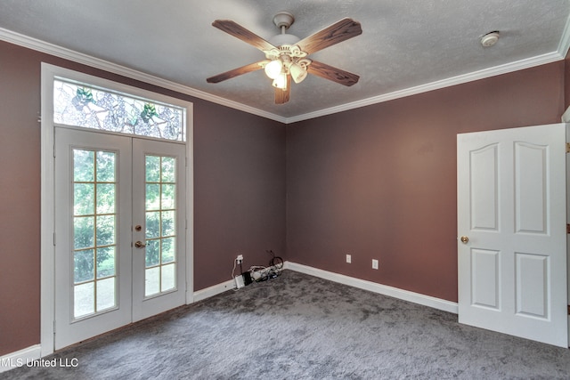 empty room featuring french doors, ceiling fan, carpet, and crown molding