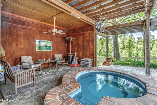 view of pool with a patio area and ceiling fan