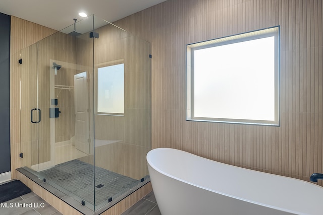 bathroom featuring tile patterned floors and plus walk in shower