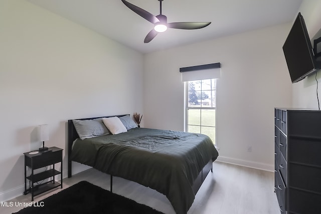 bedroom featuring light hardwood / wood-style floors and ceiling fan