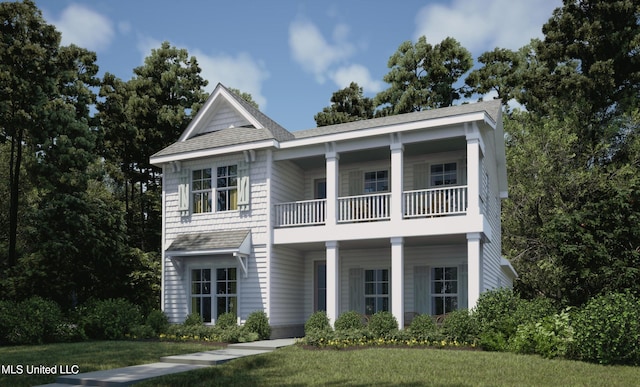 view of front of home featuring a balcony and a front lawn