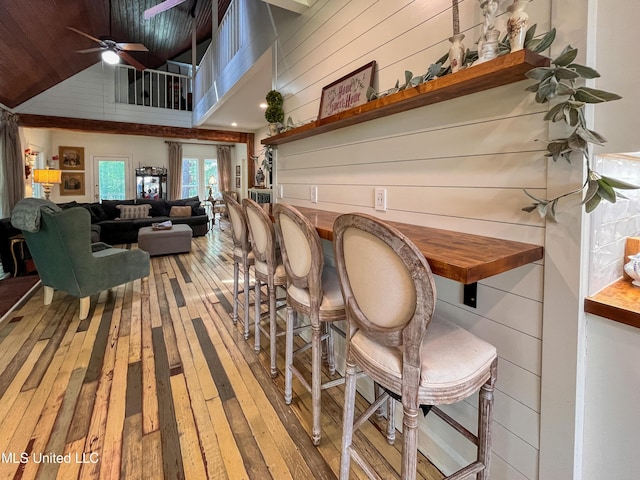 110 Quail Hollow Pl, Brandon, MS 39047 - dining area with hardwood / wood-style flooring, wooden walls, high vaulted ceiling, ceiling fan, and wooden ceiling