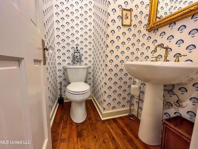 110 Quail Hollow Pl, Brandon, MS 39047 - half bathroom featuring wallpapered walls, baseboards, hardwood / wood-style flooring, and toilet