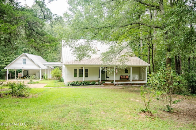 110 Quail Hollow Pl, Brandon, MS 39047 - view of front of house featuring covered porch, a front lawn, a carport, and metal roof